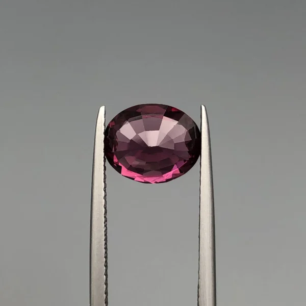 Natural purplish pink garnet 2.78 carat oval gemstone (back side)