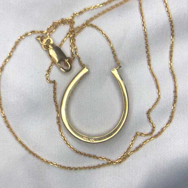 14K Gold Horseshoe Diamond Pendant 14K gold horseshoe diamond pendant with approximately 0.42ct diamonds