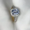 5d1d9d49-7b78-4998-b291-c5a5cf978b6b Emerald Cut Sapphire Gold Ring with Diamonds