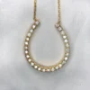 14K gold horseshoe diamond pendant with approximately 0.42ct diamonds