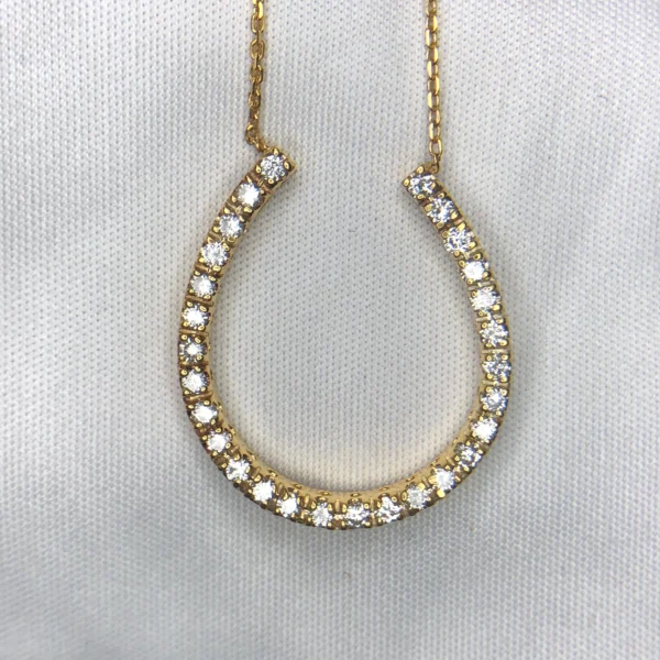 14K gold horseshoe diamond pendant with approximately 0.42ct diamonds