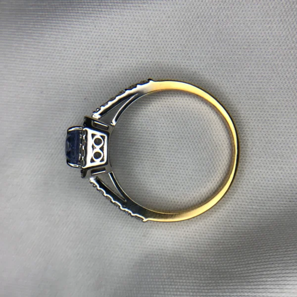 c0c60a41-5f39-4a04-8fc2-991e0bf8d166 Emerald Cut Sapphire Gold Ring with Diamonds
