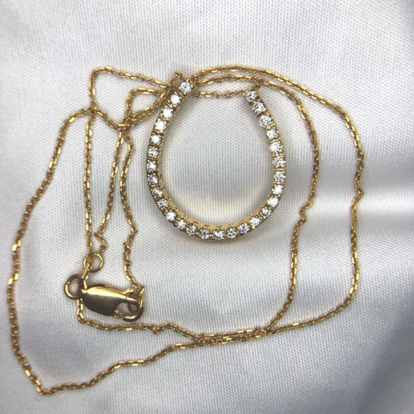 14K gold horseshoe diamond pendant with approximately 0.42ct diamonds